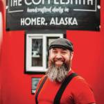 Ethan Smith, shown here in this undated photo in front of his coffee business, The Coffeesmith, at the intersection of Main Street and the Sterling Highway in Homer, Alaska. (Photo by J Coe Photography)