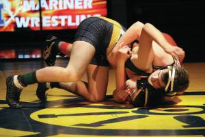 Homers Dakota Moonin grapples with Will Kretzschmar of Grace Christian School during a wrestling dual held Thursday, Oct. 31, 2019 at Homer High School in Homer, Alaska. (Photo by Megan Pacer/Homer News)