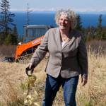 Homer writer and Storyknife Writers Retreat founder Dana Stabenow turns the earth at groundbreaking ceremonies on May 4 at the retreat property in Homer. Construction started last summer on the main house and cabins that will in a year house visiting women writers. (Photo by Michael Armstrong/Homer News)