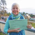Fair Share Act sponsor Jane Angvik holds an initiative petition booklet she delivered to Homer, Alaska, on Oct 25, 2019. (Photo by Michael Armstrong/Homer News)