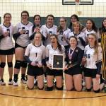 The Homer volleyball team celebrates winning the Southcentral Conference Championships on Saturday, Nov. 9, 2019 in Seward, Alaska. (Photo by Kathy Vogl)