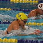 Homers Madison Story leads Dimonds Dreamer Kowatch midway through the girls 200-yard IM final Saturday, Nov. 9, 2019, at the ASAA state swimming and diving championship at the Bartlett pool in Anchorage, Alaska. (Photo by Joey Klecka/Peninsula Clarion)