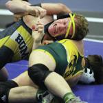 Homers Mose Hayes works to break the grip of Services Andrew Green during the semifinal round of the Lancer Smith Memorial on Friday, Nov 15, 2019, in Wasilla, Alaska. (Photo by Jeremiah Bartz/Frontiersman)