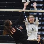 Homers Karmyn Gallios puts a block on Kenais Abby Every, Saturday, Nov. 16, 2019, at the Class 3A state volleyball tournament at the Alaska Airlines Center in Anchorage, Alaska. (Photo by Joey Klecka/Peninsula Clarion)