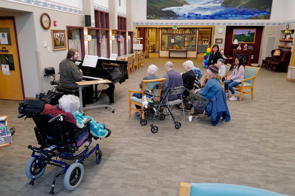 Volunteer Victor Carlisle sings and plays the piano for Juneau Pioneer Home residents on Friday, Nov. 15, 2019. (Michael Penn | Juneau Empire)