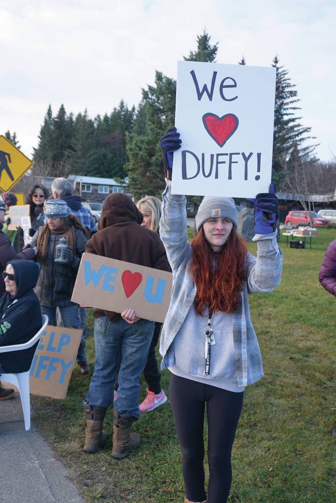 Shelby Sinn holds a sign Saturday, Nov. 23, 2019, at a vigil for Anesha Duffy Murnane, a Homer woman missing since Oct. 17, at WKFL Park in Homer, Alaska. Sinn helped organize the vigil. (Photo by Michael Armstrong/Homer News)