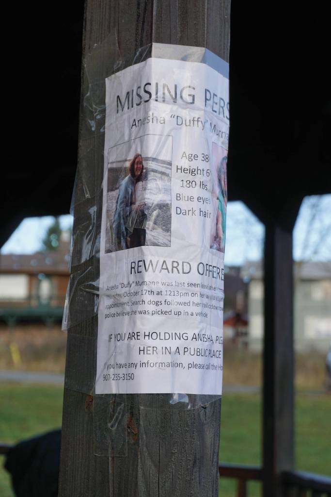 A poster for Anesha Duffy Murnane is one a post at the WKFL Park gazebo, on Saturday, Nov. 23, 2019, at a vigil for Murnane, a Homer woman missing since Oct. 17, in Homer, Alaska. (Photo by Michael Armstrong/Homer News)