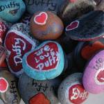 A bowl of painted rocks were given out Saturday, Nov. 23, 2019, at a vigil for Anesha Duffy Murnane, a Homer woman missing since Oct. 17, at WKFL Park in Homer, Alaska. (Photo by Michael Armstrong/Homer News)