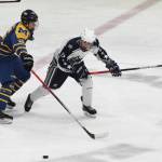 Soldotnas Aiden Burcham battles for the puck with Homers Ethan Pitzman, Friday, Nov. 22, 2019, at the Soldotna Regional Sports Complex in Soldotna, Alaska. (Photo by Joey Klecka/Peninsula Clarion)