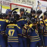 The Homer hockey team celebrates a 4-3 overtime win over Soldotna, Friday, Nov. 22, 2019, at the Soldotna Regional Sports Complex in Soldotna, Alaska. (Photo by Joey Klecka/Peninsula Clarion)