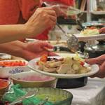 Volunteers serve a Thanksgiving meal to community members Thursday, Nov. 28, 2019 at Homer United Methodist Church in Homer, Alaska. (Photo by Megan Pacer/Homer News)