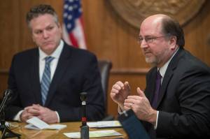 In this file photo, Gov. Mike Dunleavy, left, listens as Attorney General Kevin Clarkson describes three constitutional amendments that would be a foundation of his administrations fiscal plan during a press conference at the Capitol on Wednesday, Jan. 30, 2019. (Michael Penn | Juneau Empire File)