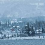 Snow and fog creep up the ridges above Homer on Monday, Dec. 2, 2019 as seen from across Beluga Lake in Homer, Alaska. Homer got its first dump of snow that stuck around on Sunday evening. (Photo by Megan Pacer/Homer News)