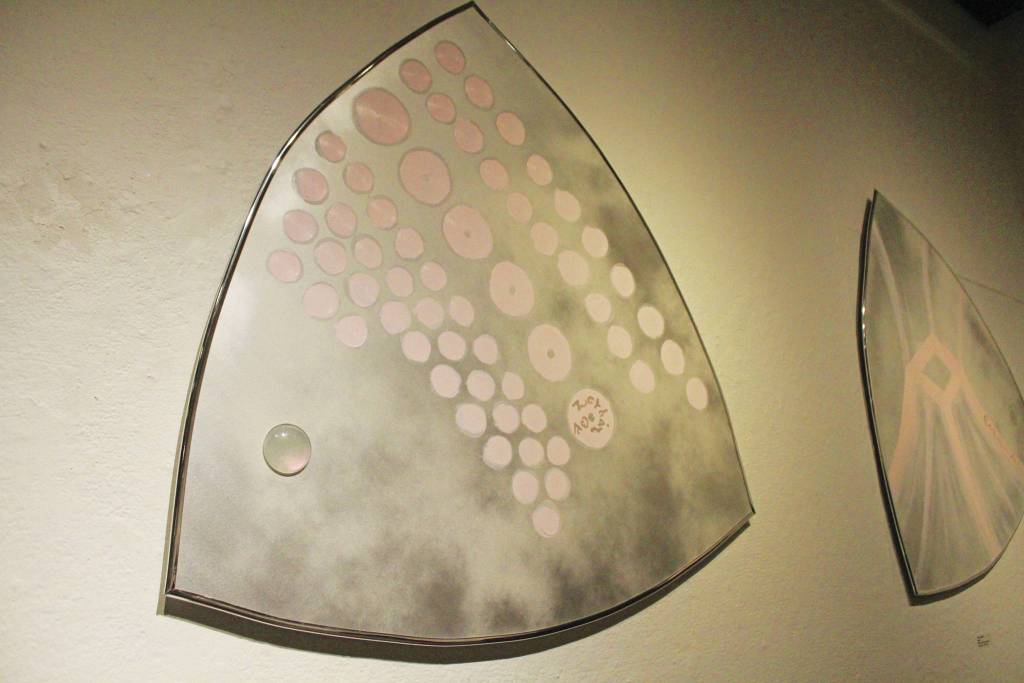 An Apollonic mirror painting called Rosaire hangs on the wall during at art exhibit opening Friday, Dec. 6, 2019 at Bunnell Street Arts Center in Homer, Alaska. The show was put together by Alaska Native artist Argent Kvasnikoff. (Photo by Megan Pacer/Homer News)