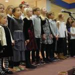 Children with the Harbor School of Music sing at the Homer Nutcracker Faire on Sunday, Dec. 8, 2019, at Homer High School in Homer, Alaska. (Photo by Michael Armstrong/Homer News)