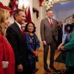Juneau Mayor Beth Weldon, right, is greeted by Gov. Mike Dunleavy, R-Alaska, and his wife, Rose, Lt. Gov. Kevin Meyer and his wife, Marti, at the Governors Open House on Tuesday, Dec. 10, 2019. (Michael Penn | Juneau Empire)