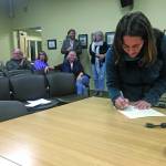 Storm Hansen-Cavasos is sworn in as a new member of the Homer City Council at a Monday, Oct. 14, 2019 council meeting at Homer City Hall in Homer, Alaska. (Photo by Megan Pacer/Homer News)