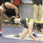 Nikiskis Pedro Souza works to maintain a grip on Homers Cayleb Diaz in a 160-pound match of the consolation rounds during the Kachemak Conference Championships Friday, Dec.13, 2019, at Redington Jr/Sr High School. (Photo by Tim Rockey/Frontiersman)