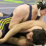 Homers Edson Knapp works to turn Sewards Lucas Brockman during a consolation match at 171 pounds on the first day of the Kachemak Conference Championships Friday, Dec. 13, 2019, at Redington Jr/Sr High School. (Photo by Tim Rockey/Frontiersman)
