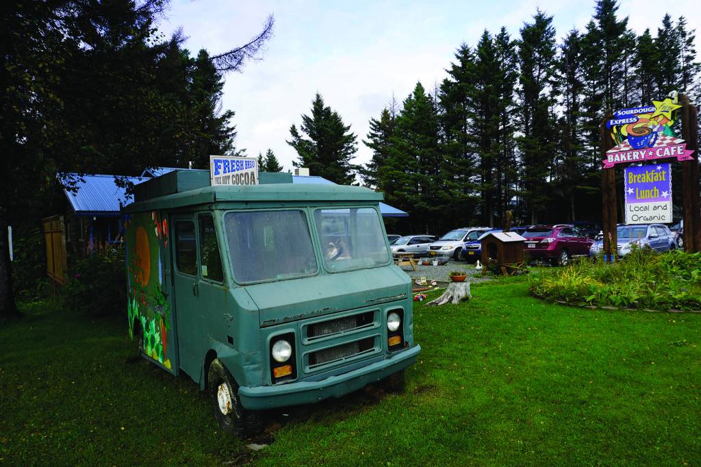 The original van of the Fresh Sourdough Express Bakery and Cafe marks the business origins. The landmark business closed last month in Homer, Alaska. (Photo by Michael Armstrong/Homer News)
