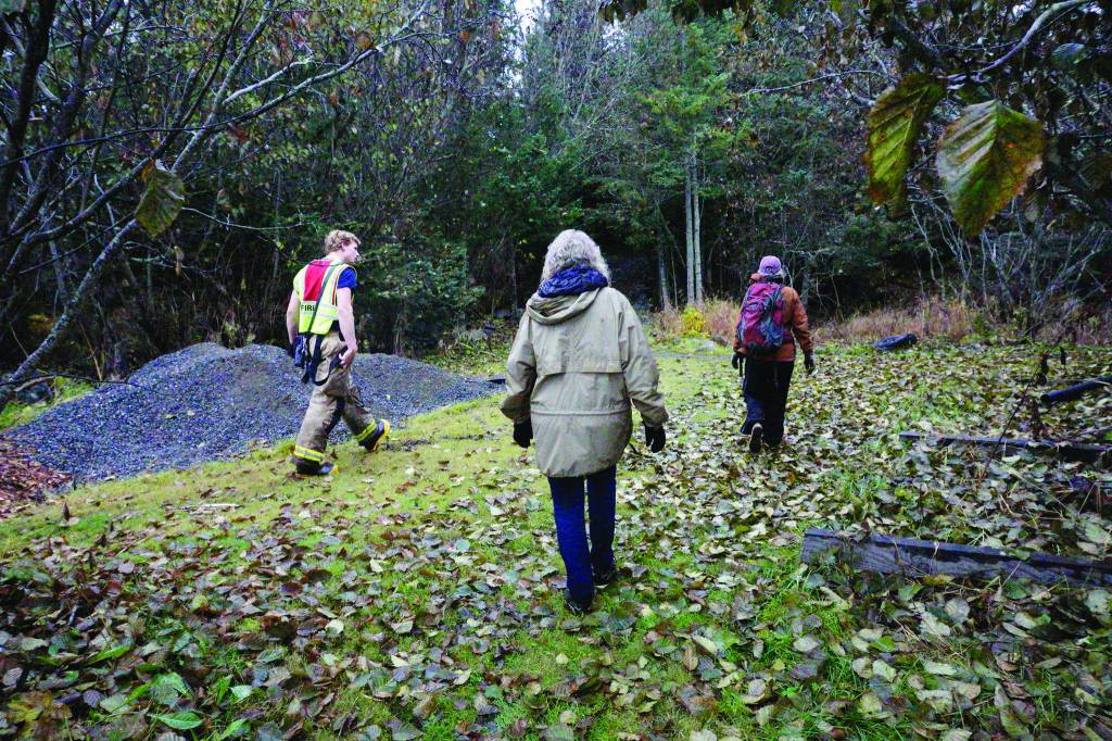 Homer Volunteer Fire Department Chief Mark Kirko, center, shows volunteers search areas at the fire hall as part of an effort on Sunday, Oct. 20, 2019, to find Anesha Duffy Murnane, reported missing on Oct. 17, 2019, in Homer, Alaska. About 50 people showed up that afternoon in an unsuccessful effort to find the missing woman. (Photo by Michael Armstrong/Homer News)
