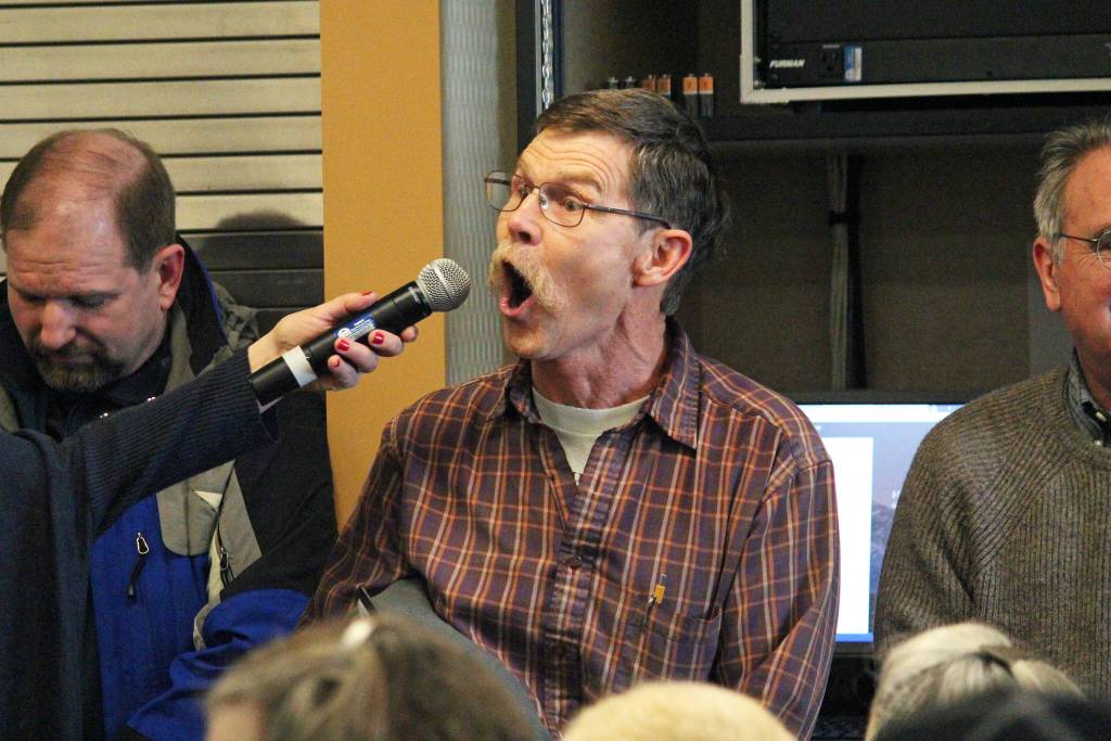 Richard Gustafson asks Rep. Sarah Vance (R-Homer) a heated question during a town hall meeting Saturday, March 2, 2019 at Kachemak Bay Campus in Homer, Alaska. (Photo by Megan Pacer/Homer News)