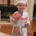 Teri Robls grandson, Kase, is ready to help his grandmother in the kitchen, as seen here on Dec. 25, 2019, at her Homer, Alaska, home. (Photo by Teri Robl)