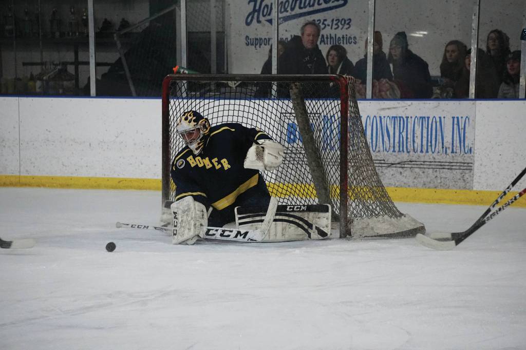 Homer High alumnus Alex Sanarov moves to block a shot during an alumni/alumnae hockey game last Friday, Dec 27, 2019, at the Kevin Bell Ice Arena in Homer, Alaska. (Photo by Michael Armstrong/Homer News)