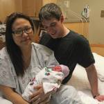 Photo by Megan Pacer/Homer News                                 Stephanie Cozadd-Pearson, left, and Jasiah Carlson (right) pose with their daughter, Ariyana Carlson, on Friday, Jan. 3 in the birthing center at South Peninsula Hospital in Homer. Ariyana Carlson was the first baby born in Homer in the new year.