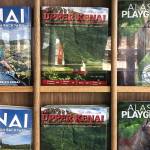 Visitor guides await travelers at the Kenai Municipal Airport, Thursday, June 20, 2019, in Kenai, Alaska. (Photo by Victoria Petersen/Peninsula Clarion)