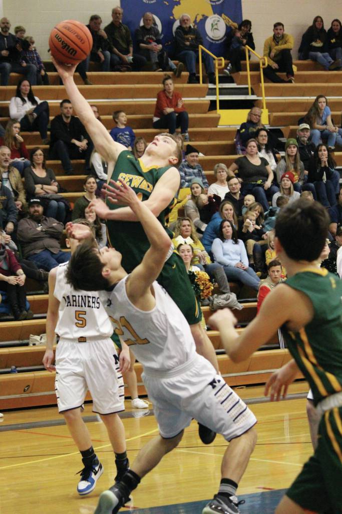 Sewards Trey Ingalls takes a shot on the Homer basket during a Saturday, Jan. 11, 2020 basketball game between the two teams in the Alice Witte Gymnasium in Homer, Alaska. (Photo by Megan Pacer/Homer News)