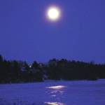 The fulll moon rises on Friday evening, Jan. 10, 2020, over Mud Bay in Homer, Alaska. (Photo by Michael Armstrong/Homer News)