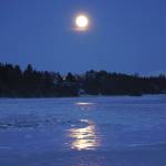 The fulll moon rises on Friday evening, Jan. 10, 2020, over Mud Bay in Homer, Alaska. (Photo by Michael Armstrong/Homer News)