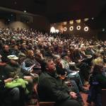 Community members fill the Homer Mariner Theatre as they wait for the memorial for Gary Thomas to begin Sunday, Jan. 19, 2020 at Homer High School in Homer, Alaska. Thomas, a local community volunteer and volunteer firefighter, was killed last week in a water heater explosion. (Photo by Megan Pacer/Homer News)