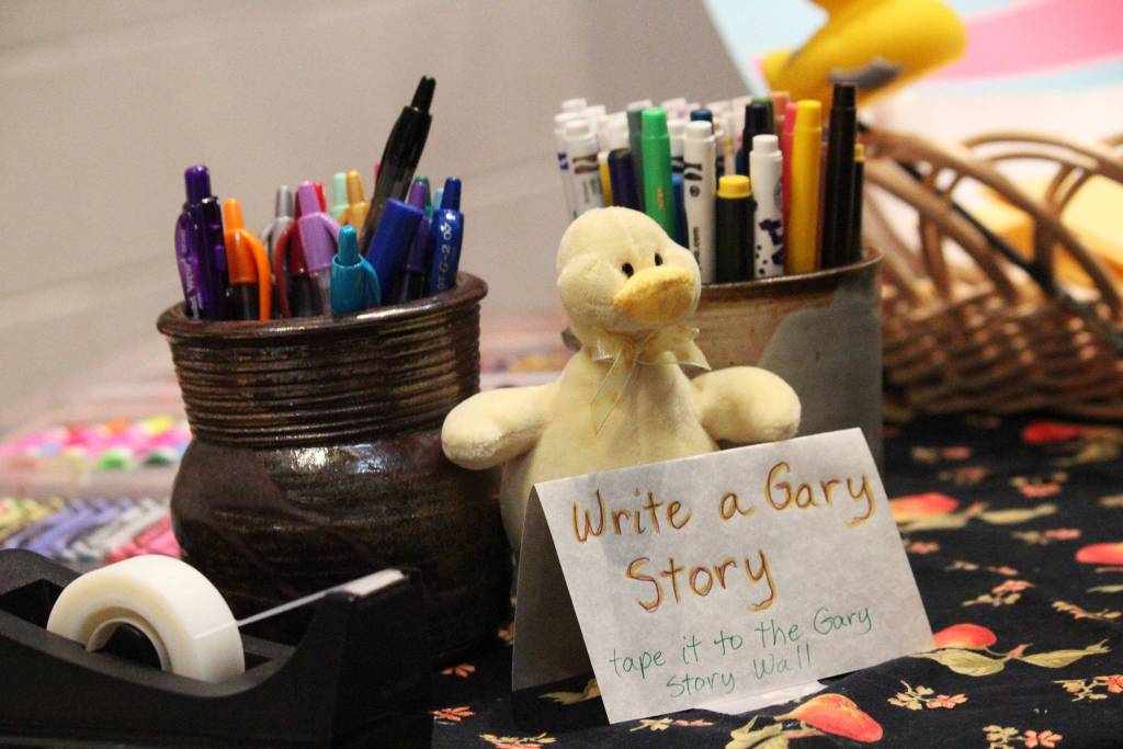 A station for writing stories and memories about a Homer man who was found dead this month after a water heater explosion rest on a table at his memorial Sunday, Jan. 19, 2020 at Homer High School in Homer, Alaska. Gary Thomas was a community volunteer and a volunteer firefighter for more than 40 years. (Photo by Megan Pacer/Homer News)