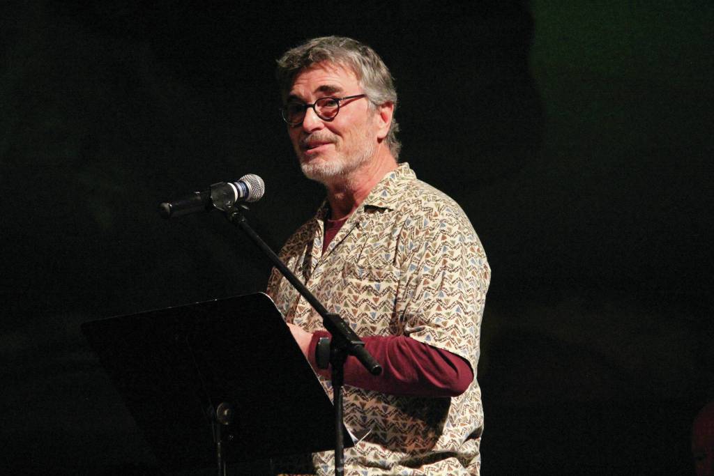 Radio personality Tom Bodett, known for the popular Motel 6 commercial line, Well keep the light on for you, speaks at a memorial for Homer resident Gary Thomas, who was found dead this month after a water heater explosion, on Sunday, Jan. 19, 2020 in the Homer Mariner Theatre at Homer High School in Homer, Alaska. Thomas and Bodett worked together on the radio show End of the Road. (Photo by Megan Pacer/Homer News)