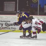 Homers Tyler Gilliland tries to keep the puck from Kenai Centrals Caden Warren on Saturday, Jan. 18, 2020, at the Kenai Multi-Purpose Facility in Kenai, Alaska. (Photo by Jeff Helminiak/Peninsula Clarion)
