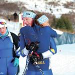 Homers Autumn Daigle (foreground) and Zoe Stonorov embrace after Stonorovs finish at one of the Besh Cup Races on Sunday, Jan. 19, 2020 at the Lookout Mountain Trails on Ohlson Mountain Road near Homer, Alaska. (Photo by Megan Pacer/Homer News)