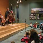 Enthralled kids enjoy the community concert with Low and Lower on Wednesday, Jan. 15, 2020 at Alaska Islands and Ocean Visitor Center in Homer, Alaska. (Photo courtesy Kim Fine)
