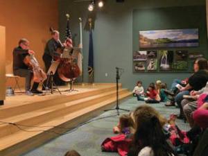 Enthralled kids enjoy the community concert with Low and Lower on Wednesday, Jan. 15, 2020 at Alaska Islands and Ocean Visitor Center in Homer, Alaska. (Photo courtesy Kim Fine)