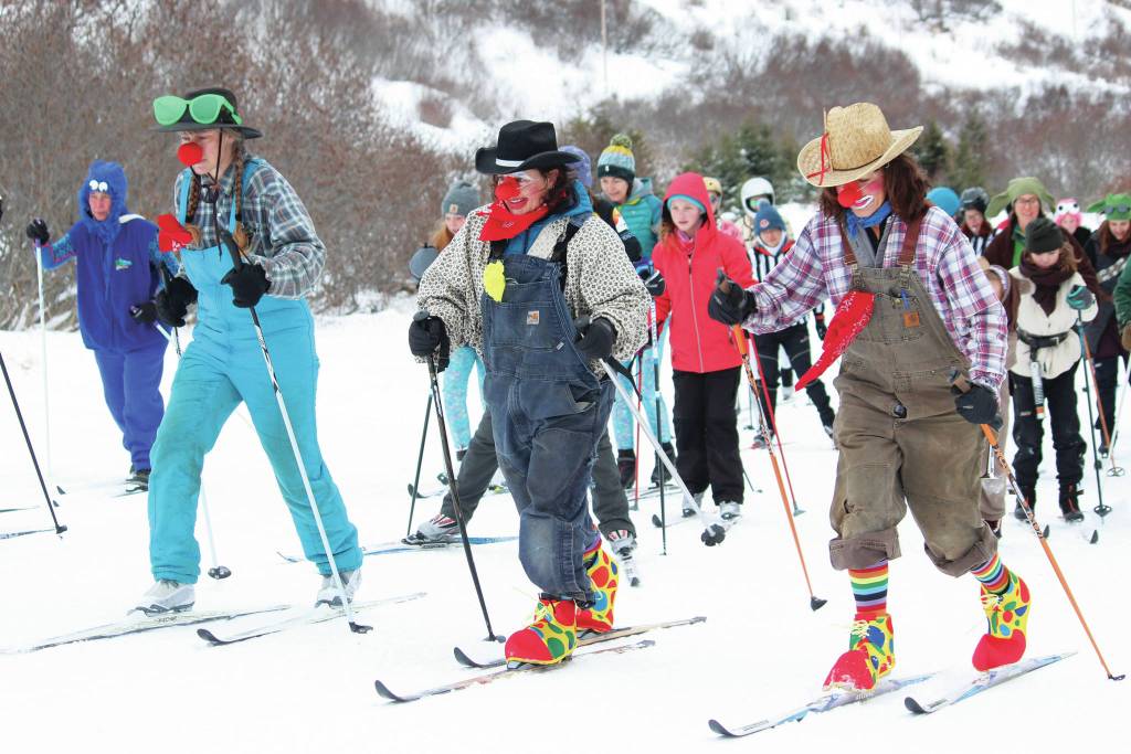 Three skiers dressed as clowns take off at the start of this years Ski for Women on Sunday, Feb. 2, 2020 at the Lookout Trails on Ohlson Mountain Road near Homer, Alaska. (Photo by Megan Pacer/Homer News)