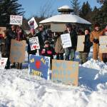 Friends of Anesha Duffy Murnane and members of the community supporting the campaign to bring her home pose with signs during a candlelight vigil held at WKFL Park in Homer, Alaska on Saturday, Feb. 1, 2020. (Photo by Delcenia Cosman)