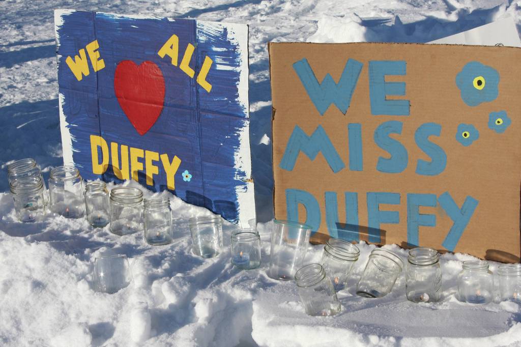 Painted signs posted at the candlelight vigil held for Anesha Duffy Murnane on Saturday, Feb. 1, 2020, at WKFL Park in Homer, Alaska, affirm love for Murnane and beseech her safe return. (Photo by Delcenia Cosman)