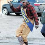Jim Maloney, this years winner of the Mr. Homer Contest, marches down Pioneer Avenue in this years Homer Winter Carnival Parade on Saturday, Feb. 8, 2020 in Homer, Alaska. (Photo by Megan Pacer/Homer News)