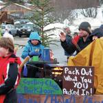 Parade participants with the Friends of Kachemak Bay State Park float move along Pioneer Avenue in this years Homer Winter Carnival Parade on Saturday, Feb. 8, 2020 in Homer, Alaska. (Photo by Megan Pacer/Homer News)