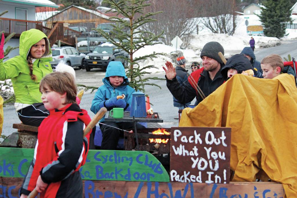 Parade participants with the Friends of Kachemak Bay State Park float move along Pioneer Avenue in this years Homer Winter Carnival Parade on Saturday, Feb. 8, 2020 in Homer, Alaska. (Photo by Megan Pacer/Homer News)