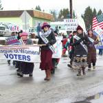 Representatives of the Kenai Peninsula League of Women Voters, based on the central peninsula, walk in this years Homer Winter Carnival Parade on Saturday, Feb. 8, 2020 on Pioneer Avenue in Homer, Alaska. (Photo by Megan Pacer/Homer News)