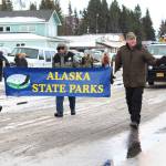 Representatives from the Alaska State Parks march in this years Homer Winter Carnival Parade on Saturday, Jan. 8, 2020 on Pioneer Avenue in Homer, Alaska. This years theme was a tribute to the 50th anniversary of Kachemak Bay State Park. (Photo by Megan Pacer/Homer News)