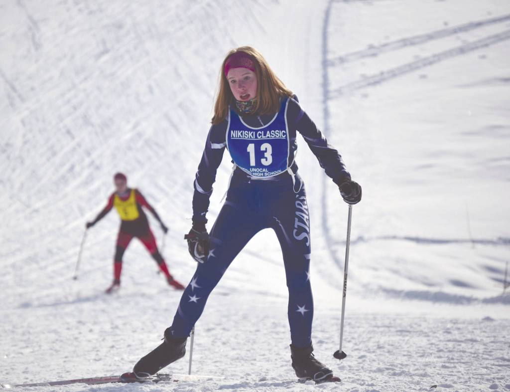 Soldotnas Sonja Saleva climbs a hill at the Kenai Peninsula Borough Nordic ski championships Saturday at Tsalteshi Trails just outside of Soldotna. (Photo by Jeff Helminiak/Peninsula Clarion)