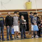 Senior members of the Homer boys varsity basketball team are honored on senior night before a Friday, Feb. 28, 2020 game against Nikiski in the Alice Witte Gymnasium in Homer, Alaska. (Photo by Megan Pacer/Homer News)